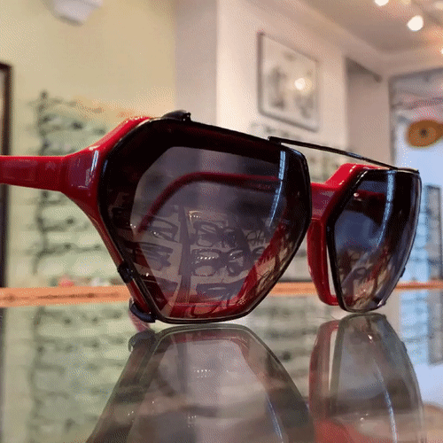 A GIF of a Henau Lancono frame in red, with and without a bespoke clip on sunglass