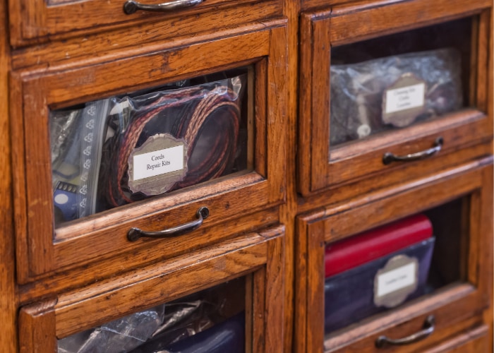 Four apothecary drawers full of spectacle accessories